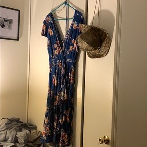 Blue flowery calf length wrap dress.